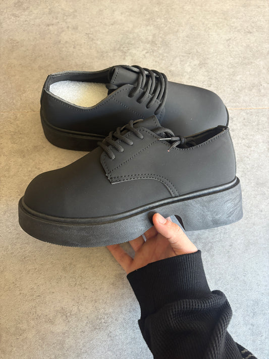 A, black chunky boots