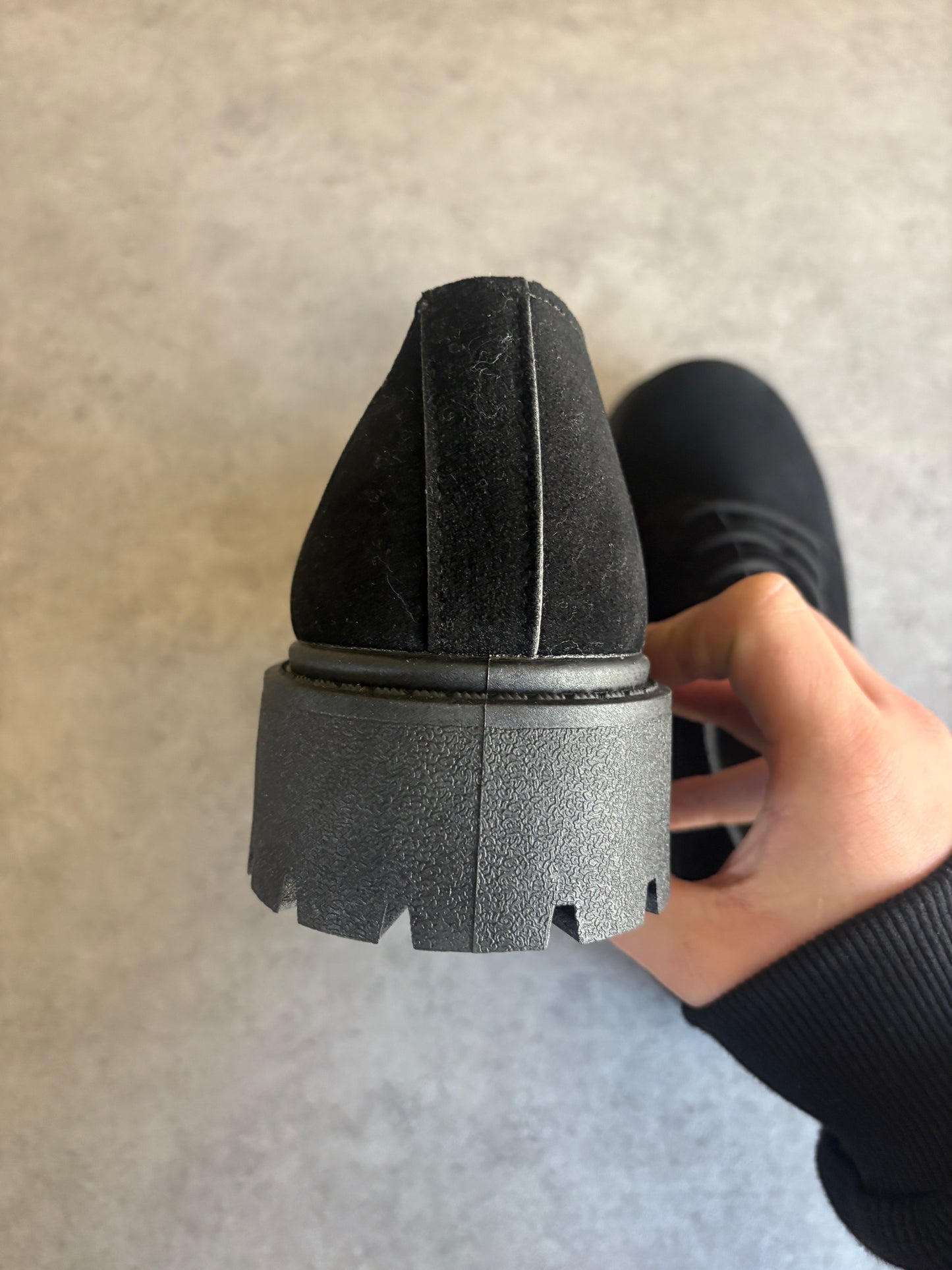 A , black suede “ runway “ boots