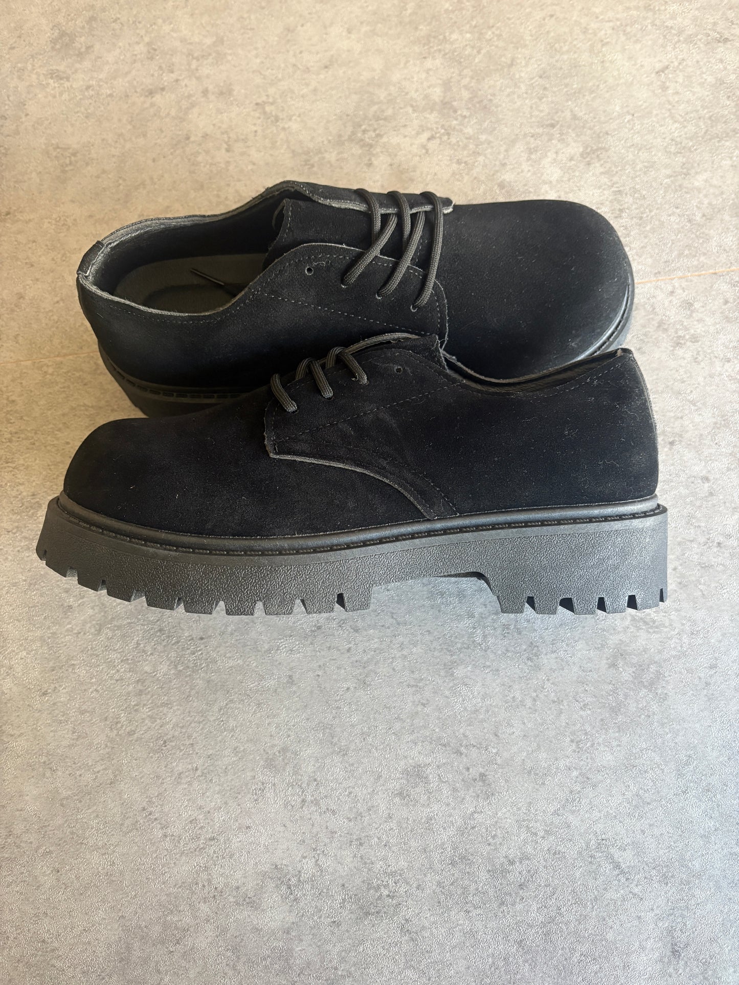 A , black suede “ runway “ boots