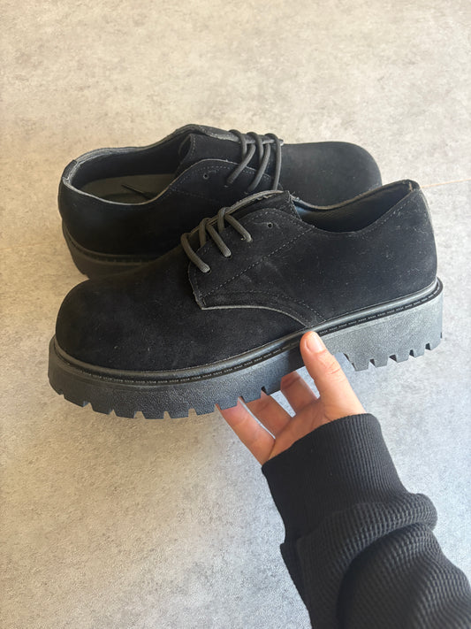 A , black suede “ runway “ boots