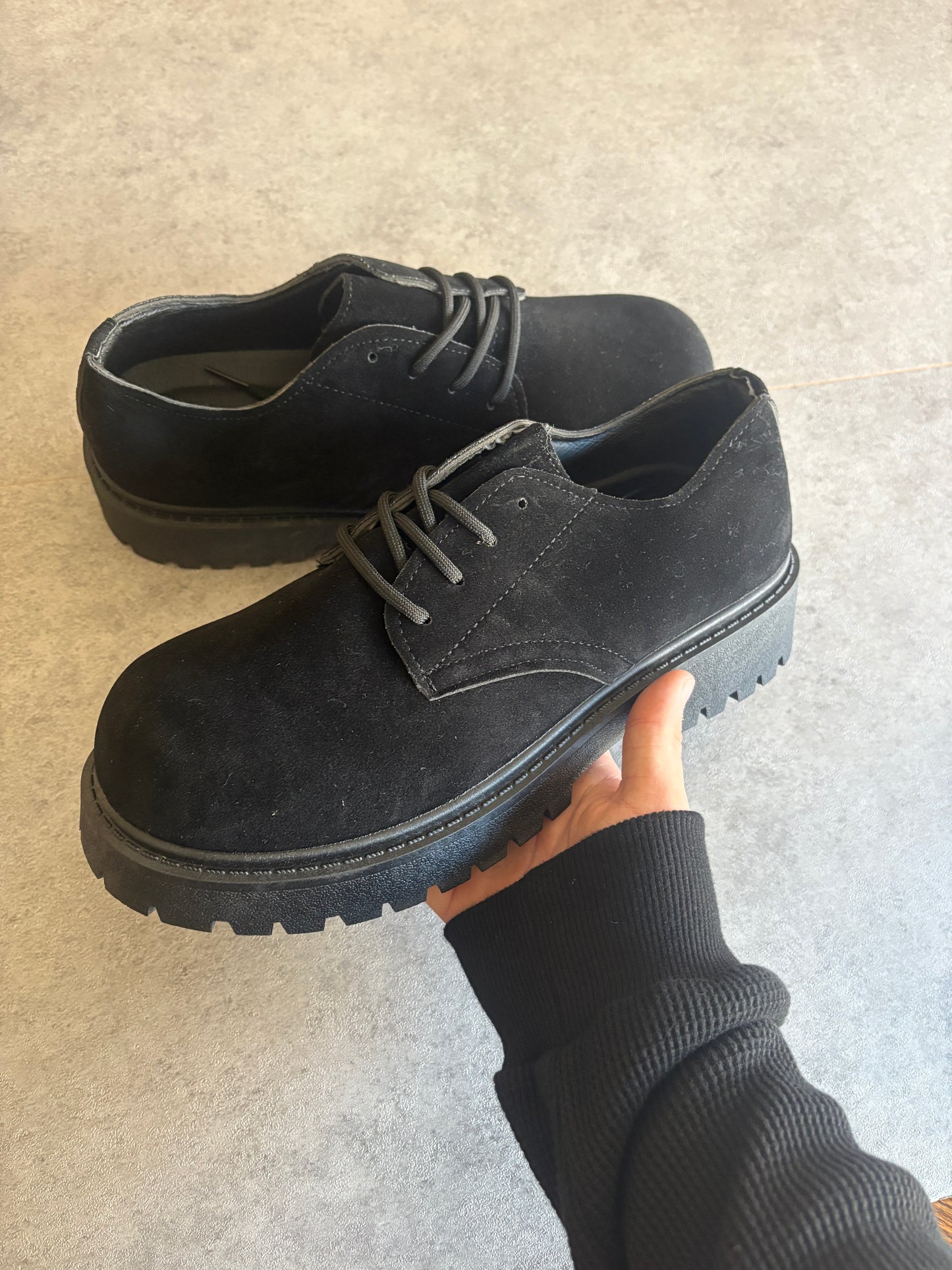A , black suede “ runway “ boots